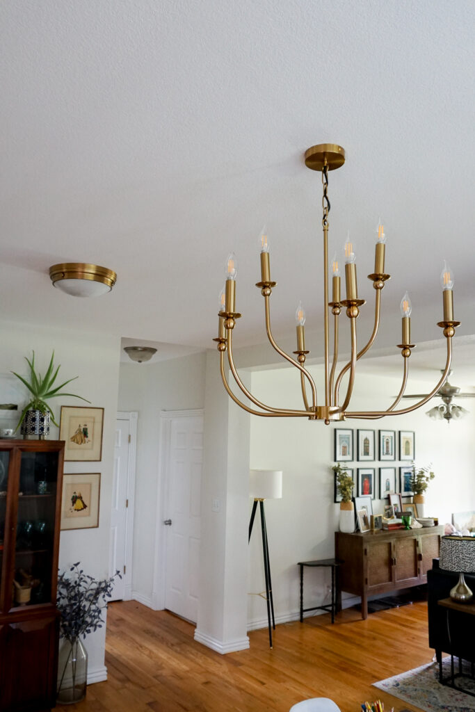 Two gold lights in a dining room